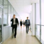 12836743 - business people walking in the office corridor