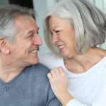 9031645 - senior couple sitting in sofa at home